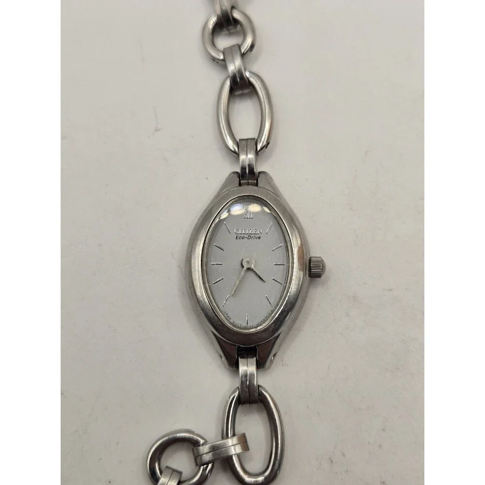 Citizen Eco-Drive Oval Silver Tone White Dial Heart Charm Bracelet Watch.